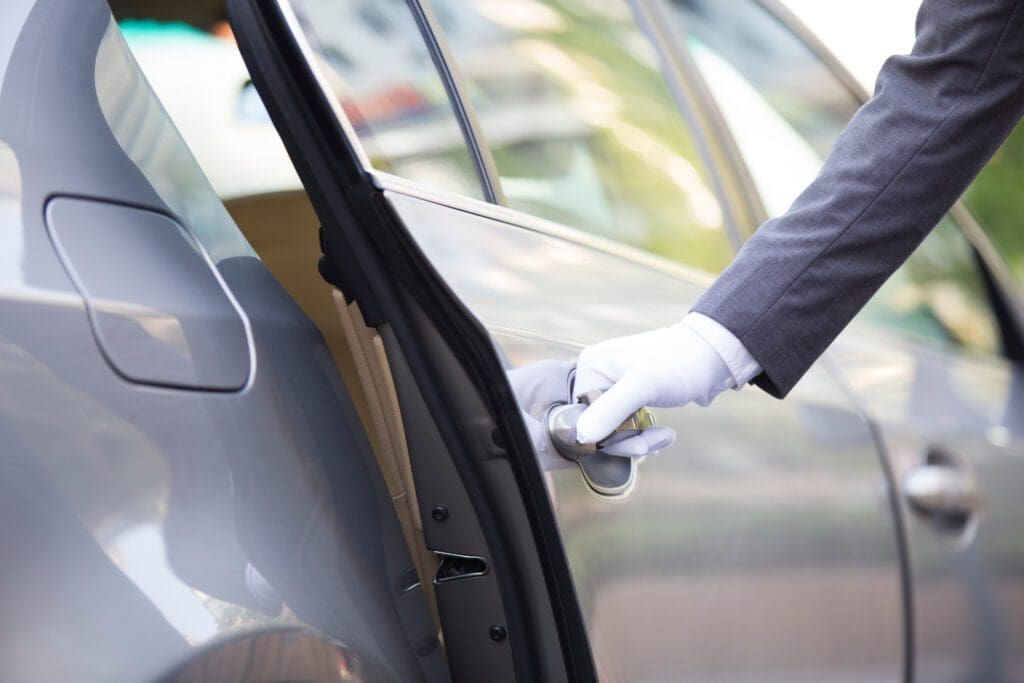 chauffeur opening car door 2022 03 29 0337 57 37 utc scaled