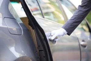 chauffeur opening car door 2022 03 29 0337 57 37 utc scaled