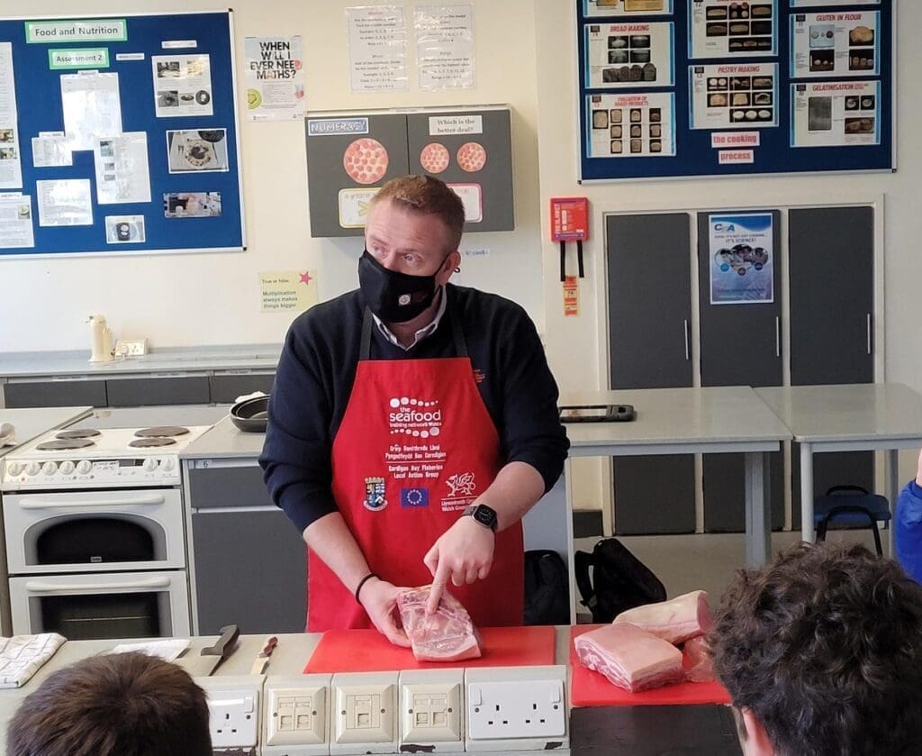 Chris Jones from Cambrian Training demonstrating the different cuts of pork 1