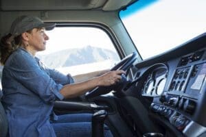 caucasian woman truck driver in the cab of her com 2022 03 04 02 19 18 utc